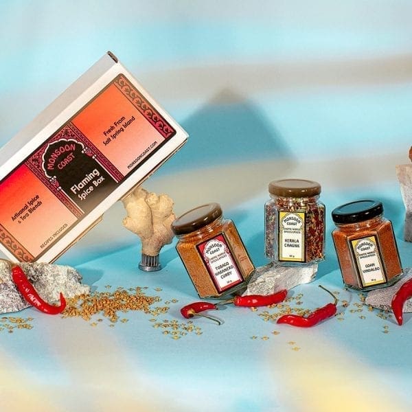 Flaming Spice Box showing jars - Tobago Habanero Curry, Kerala Chaunk, and Goan Vindaloo